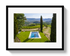 Framed photograph of a pool with a scenic landscape in the background