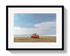 Framed photograph of a red van with a surfboard on a beach