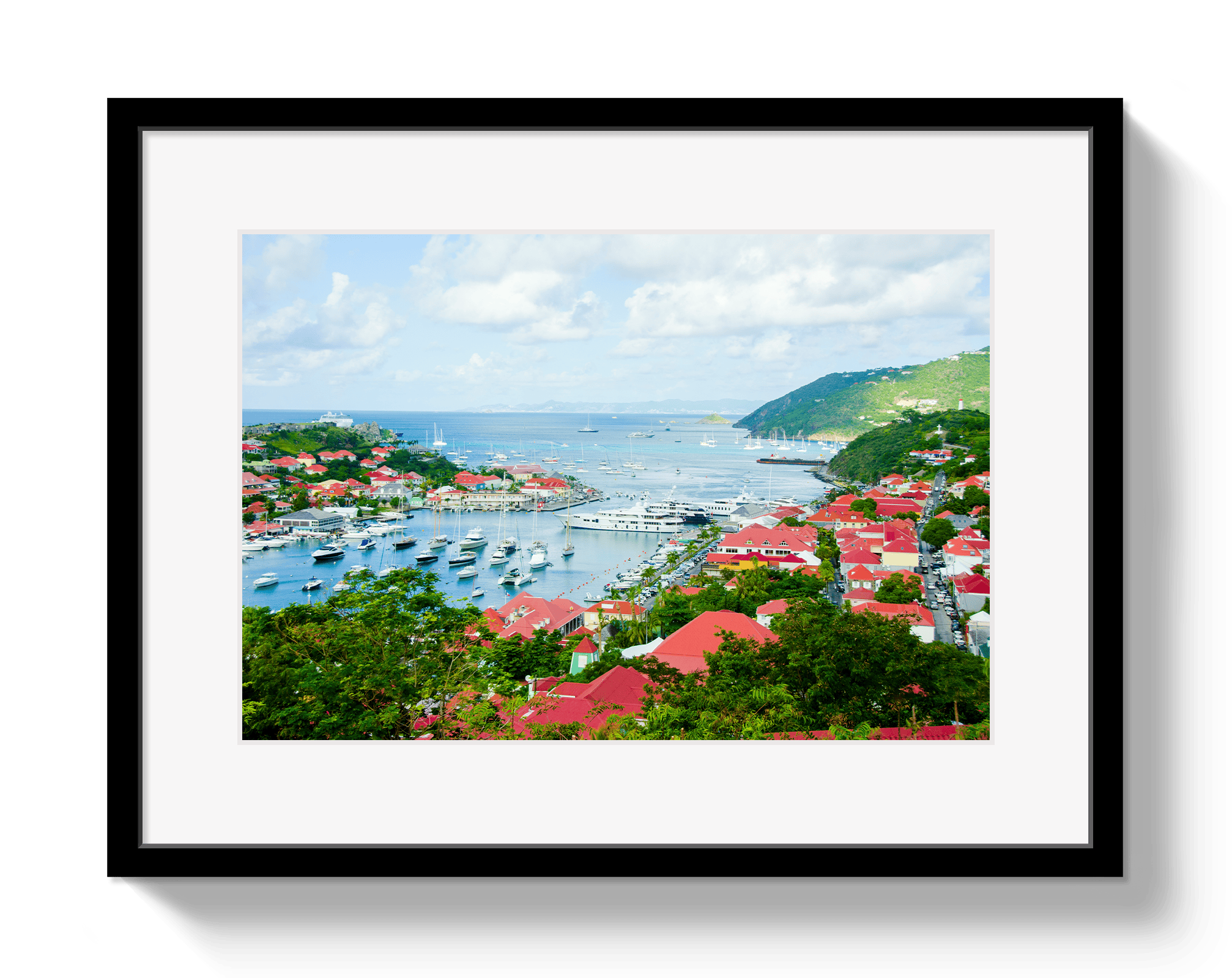 Framed artwork of a coastal town with red roofs and a harbor.