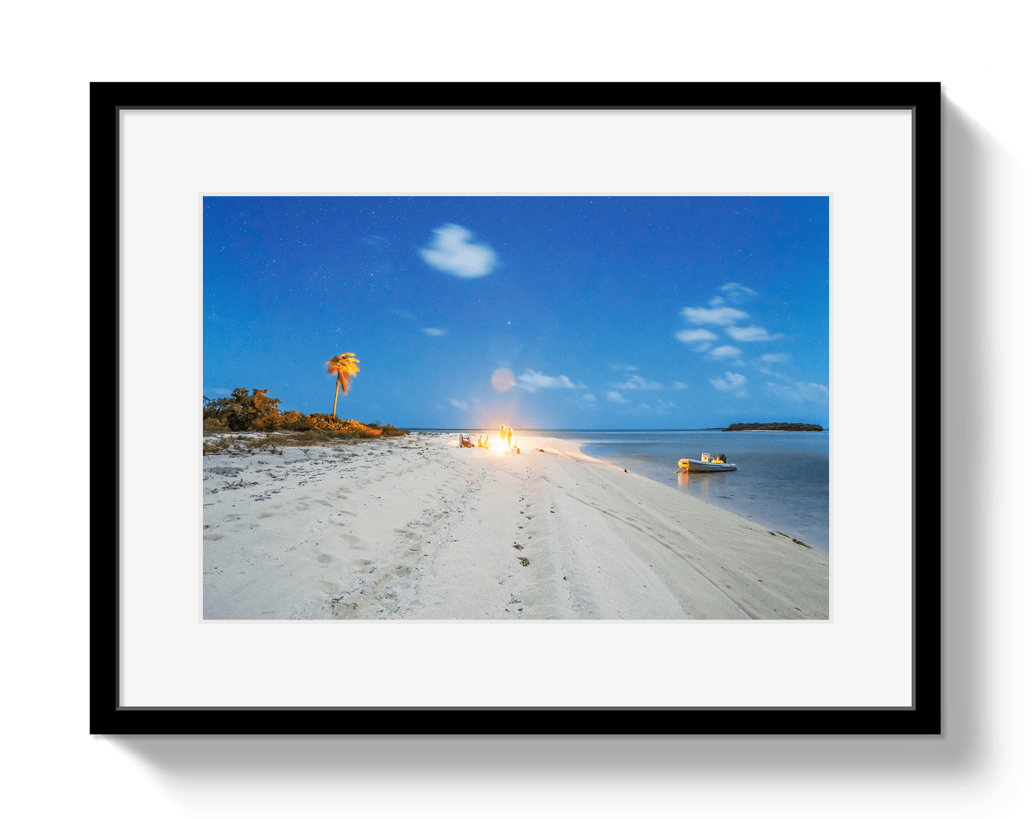 Framed photograph of a beach scene with palm trees and a clear sky.