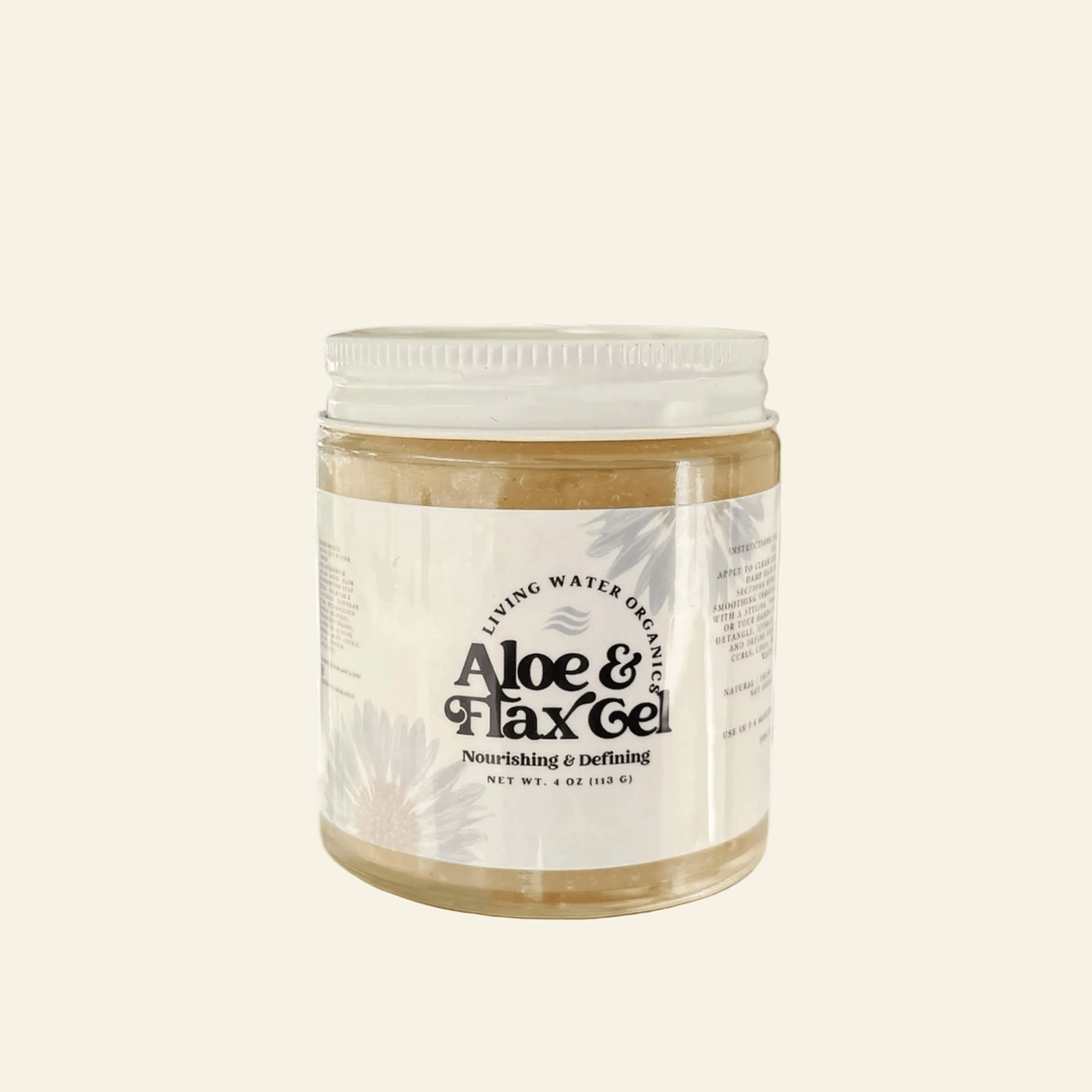 Jar of Aloe &amp; Flax Gel on a white surface with a blurred window background