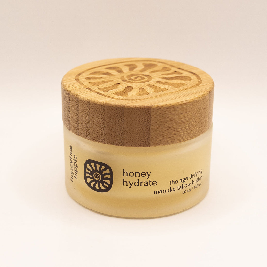 Jar of honey hydrate with wooden lid on a white background