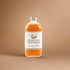 Bottle of spiced apple hot toddy with a label on a white background