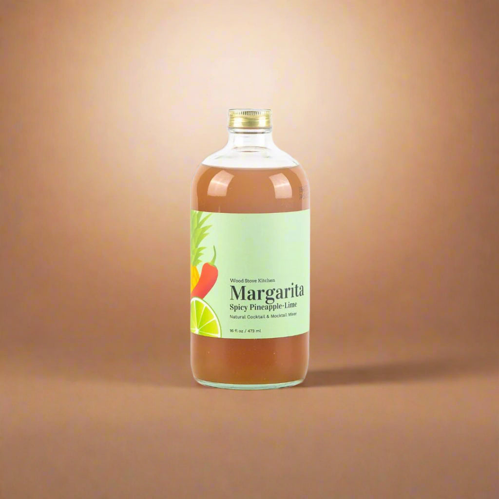Bottle of Spicy Pineapple-Lime Margarita on a beige background