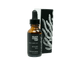 Bottle of Black Coral Tide beard oil with a dropper and packaging on a white background