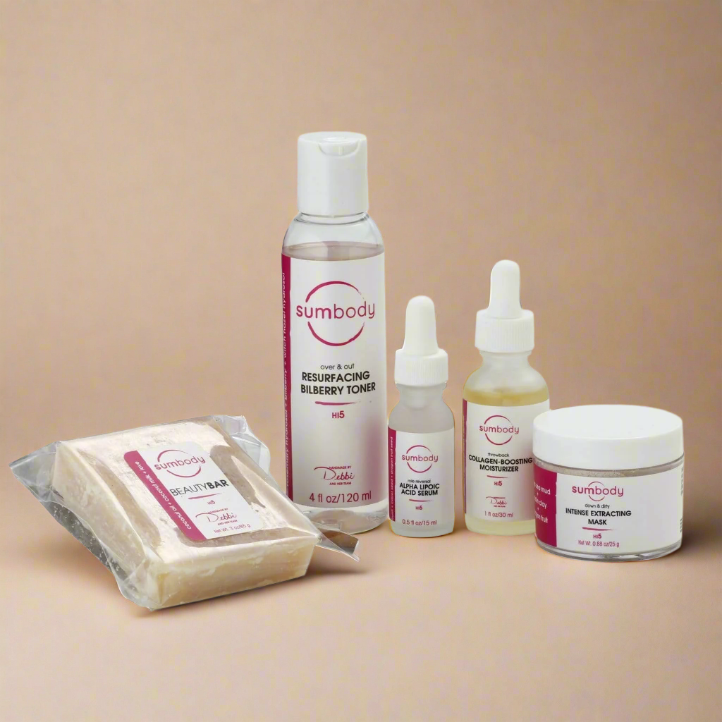 Sumbody skincare product set including toner, serum, and soap on a white background