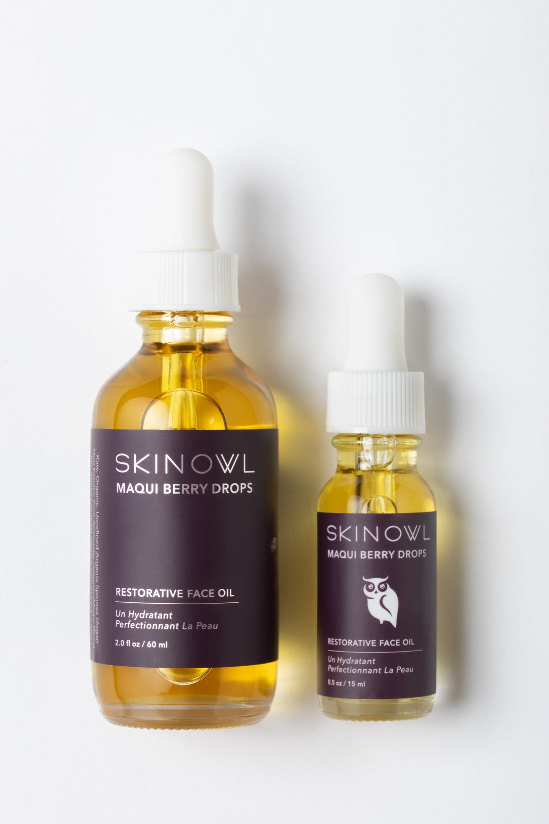 Two bottles of SKINOWL Maqui Berry Drops on a white background