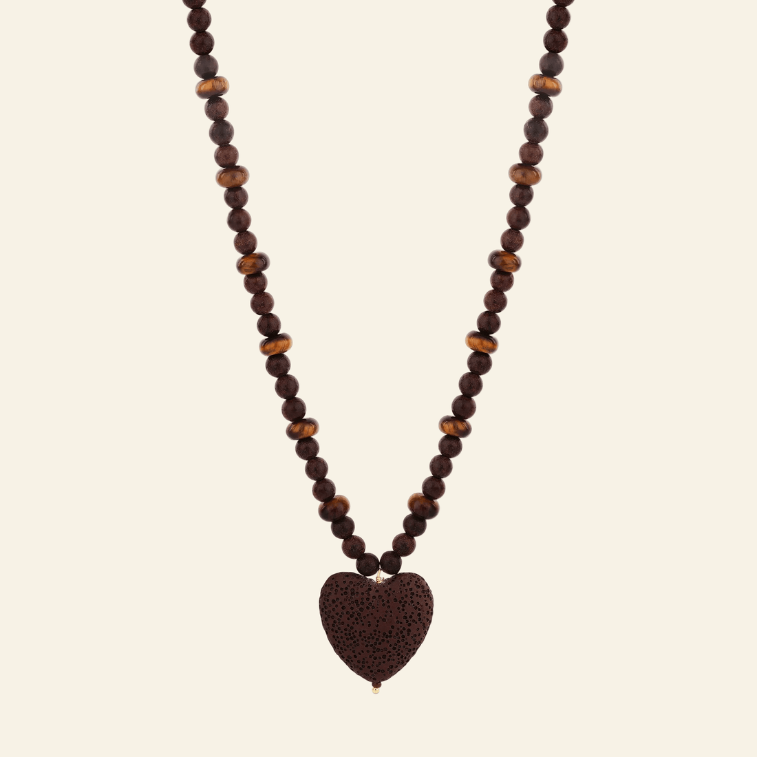Necklace with heart-shaped brown pendant on a white background