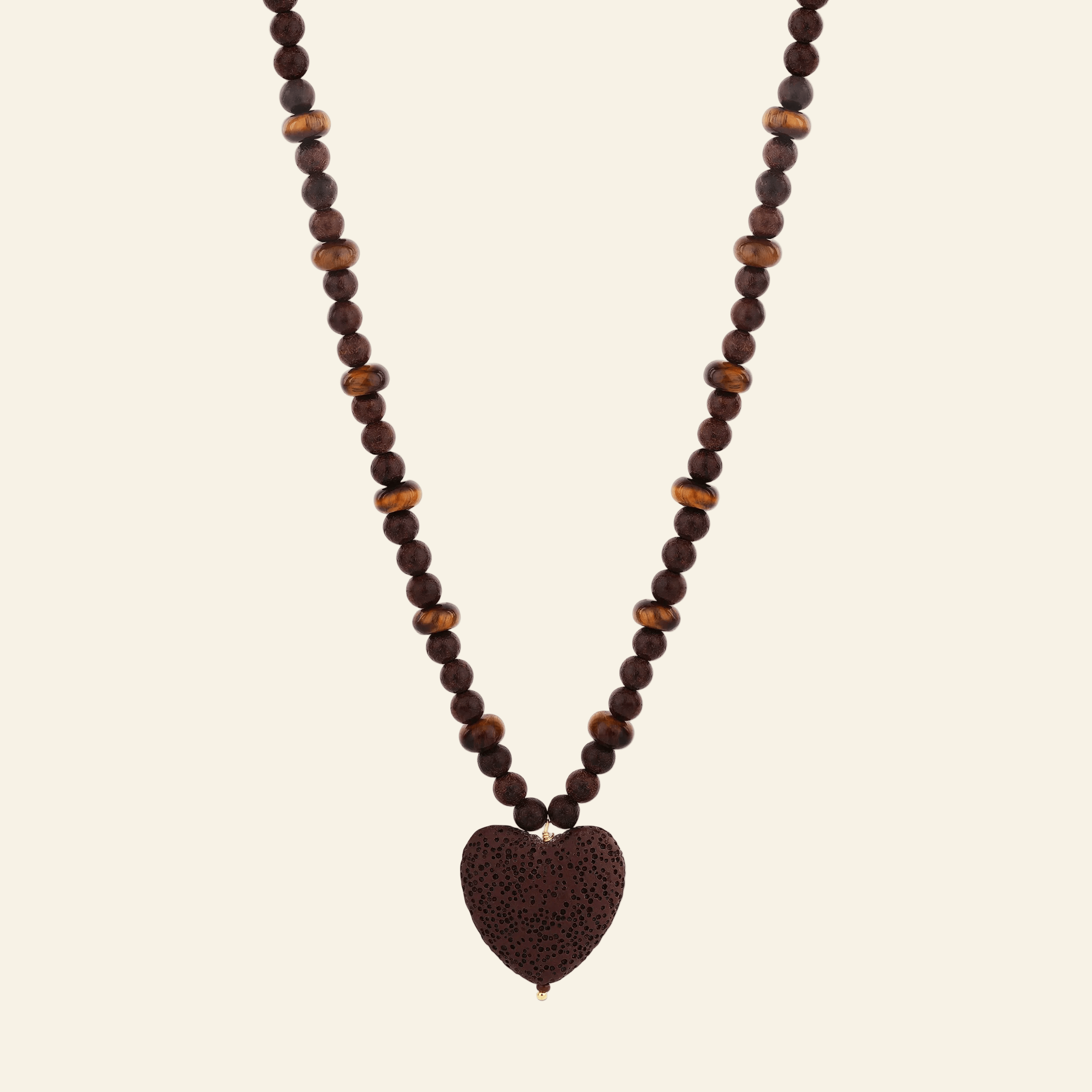 Necklace with heart-shaped brown pendant on a white background