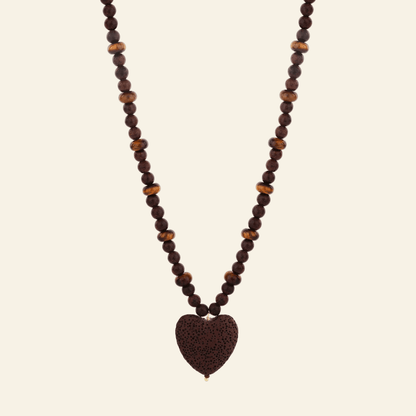 Necklace with heart-shaped brown pendant on a white background