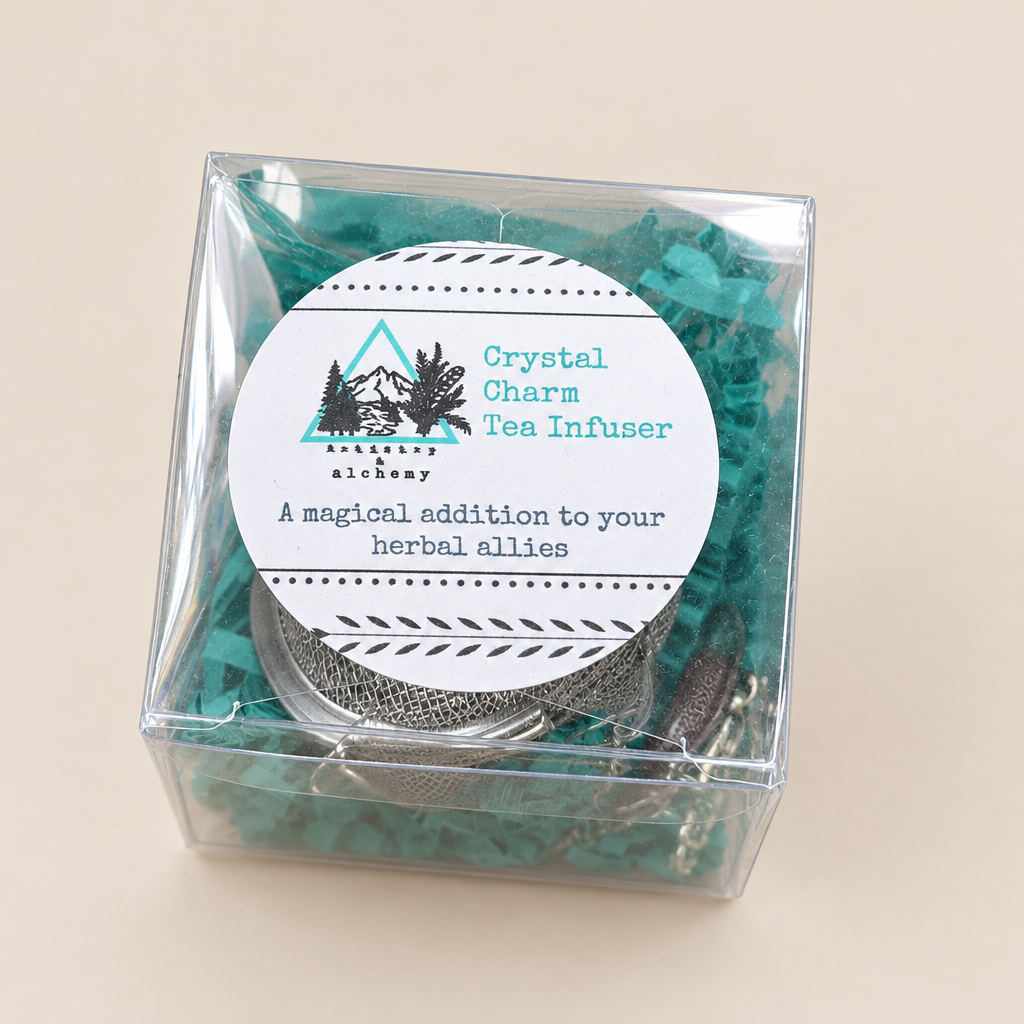 Tea infuser with a label in front of crystals
