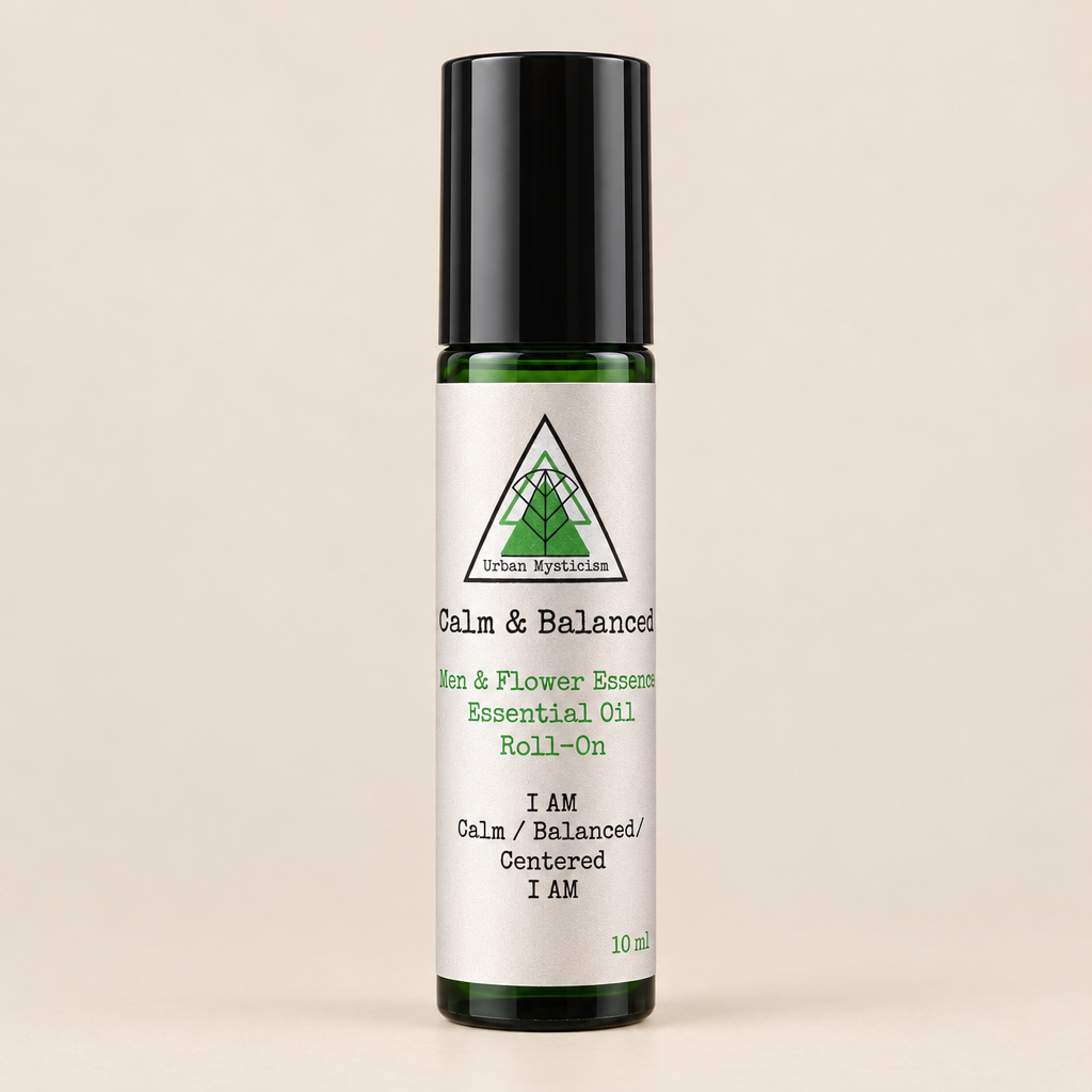 Roll-on bottle of Calm &amp; Balanced essential oil with a wooden background
