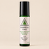 Roll-on bottle of essential oil with a label on a wooden surface