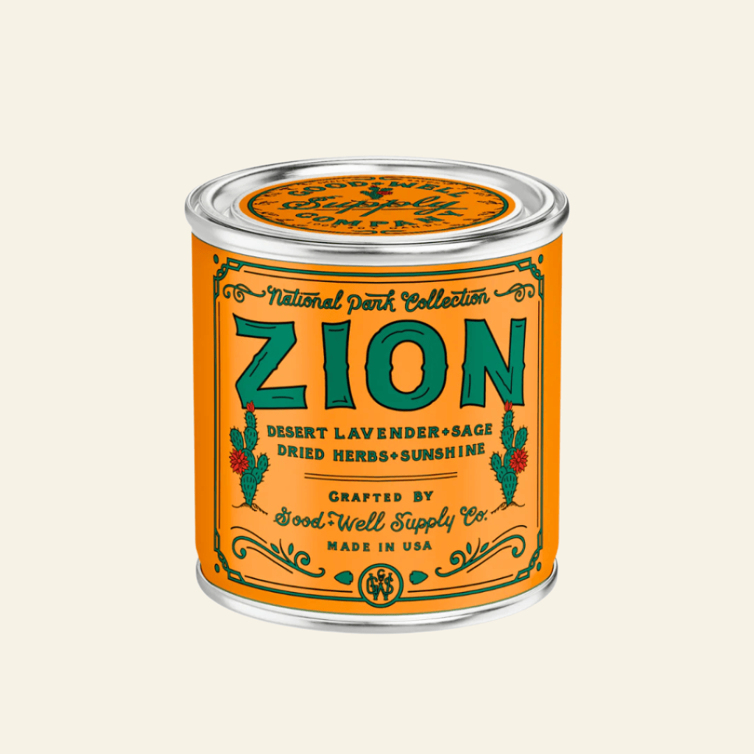 Zion candle in a tin with an orange label on a white background