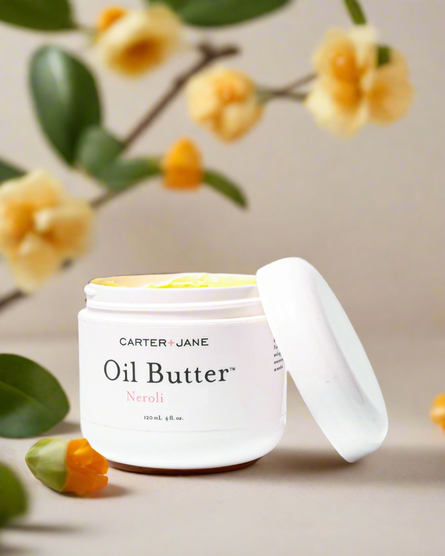 Carter &amp; Jane Oil Butter container with flowers in the background