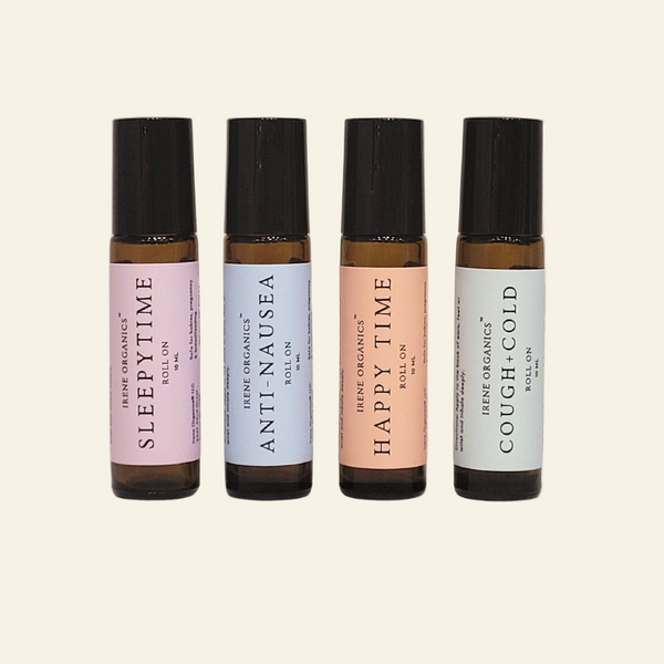 Four bottles of IRENE ORGANICS roll-on products on a white background