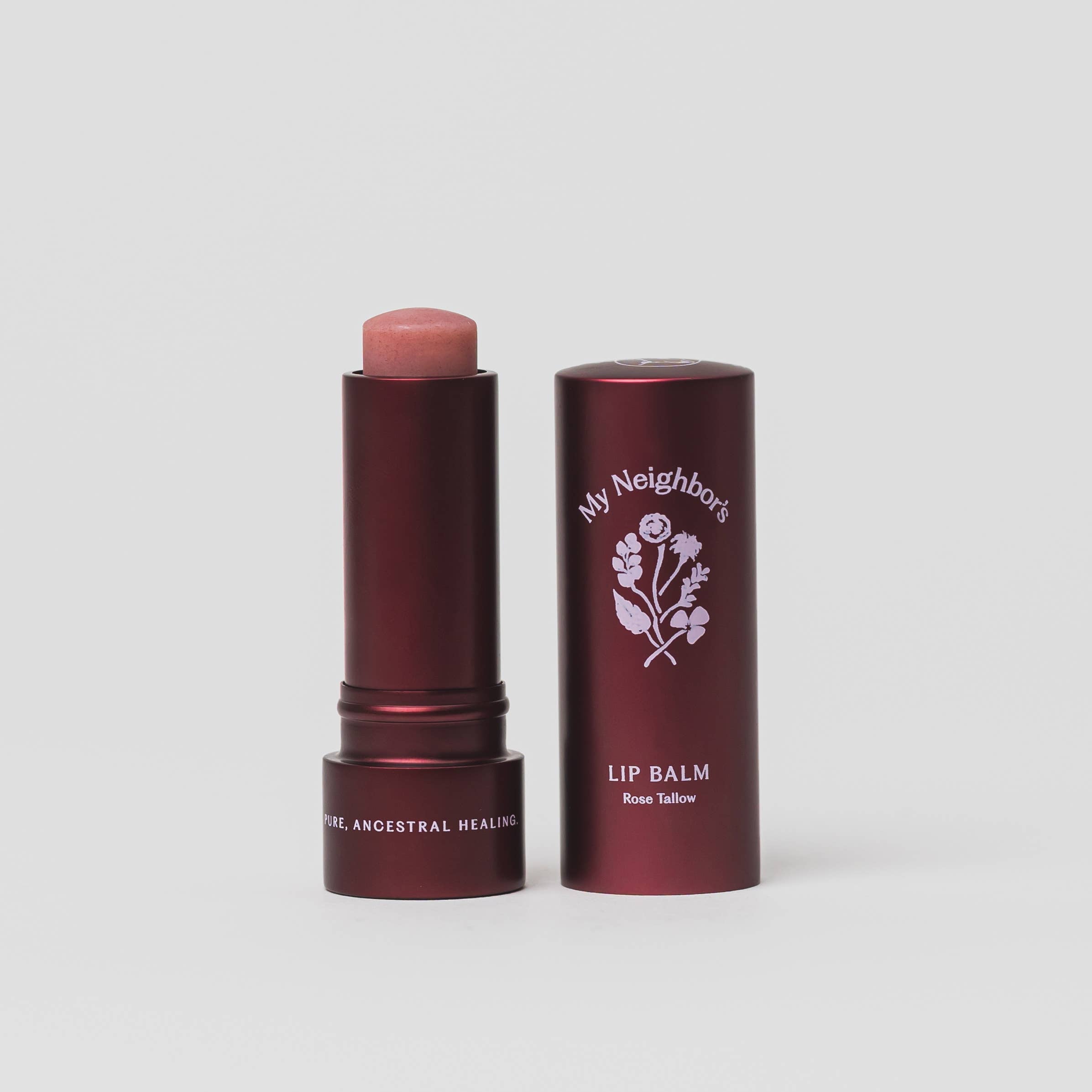 Lip balm with red packaging and visible brand logo on a light gray background