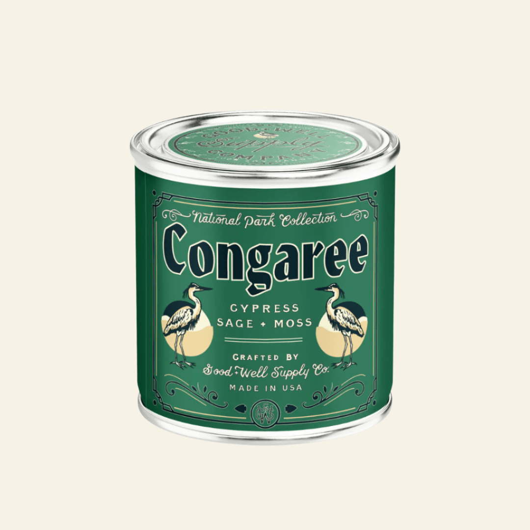 Congaree candle in a green container with a label on a white background