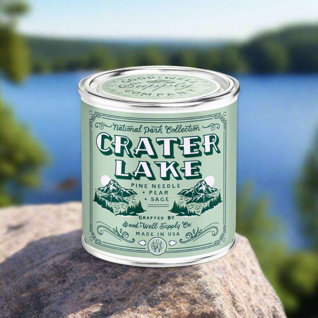 Candle in a tin labeled &