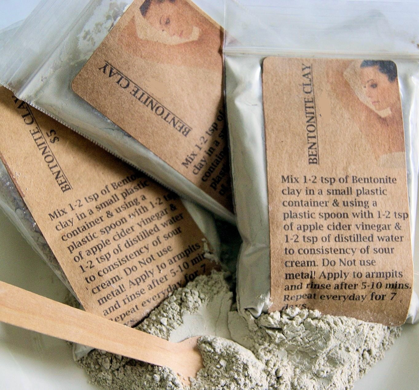 Bentonite clay packets with instructions on a white background