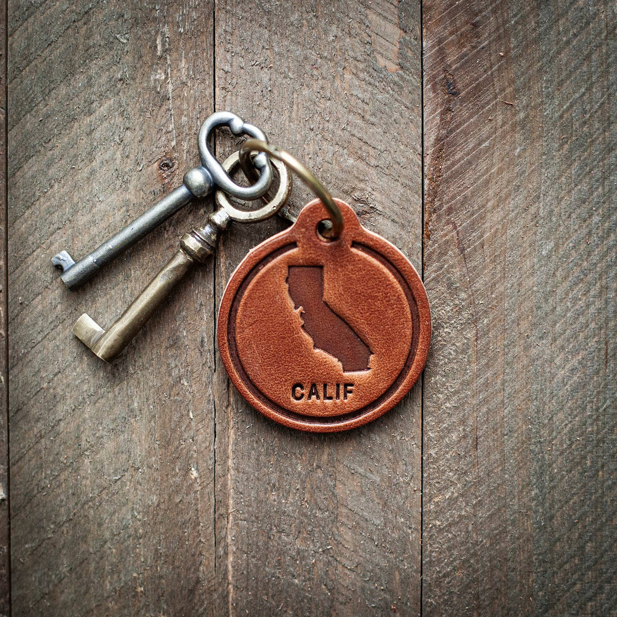 California State Silhouette Leather Keychain Circle