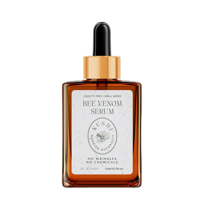 Kushi Bee Venom Serum in an amber glass dropper bottle with a gold collar and black rubber dropper, on a white background.