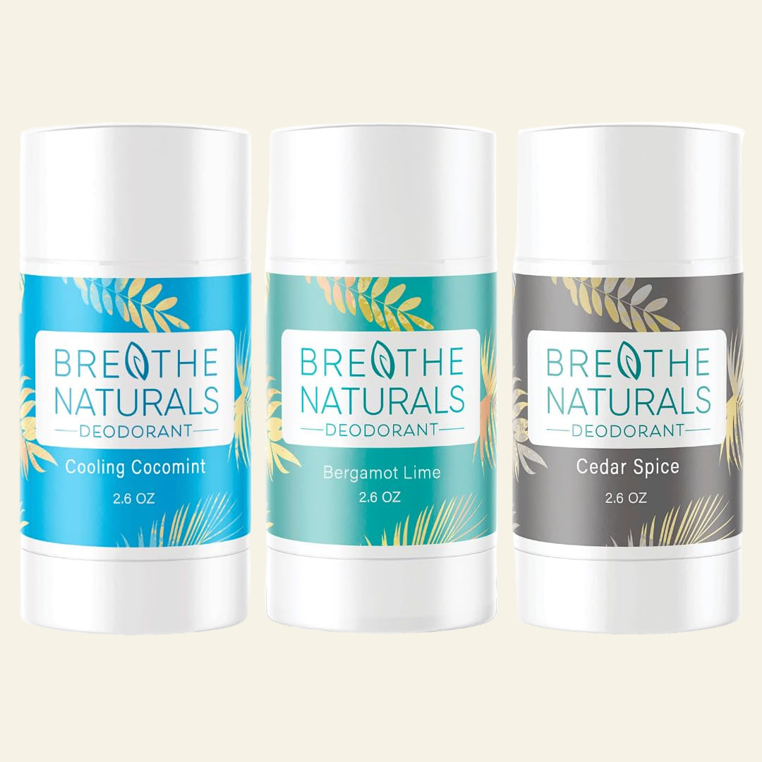 Three Breathe Naturals deodorant sticks with different scents on a white background
