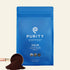Blue bag of Purity Coffee with a scoop of ground coffee on a white background