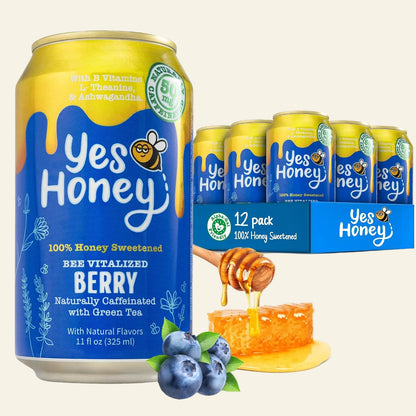 A 11 fl oz can of Yes Honey Berry beverage in the foreground with a 12-pack display box and several cans behind it on a white studio background. Blueberries, honeycomb, and honey are shown as flavor/ingredient props.