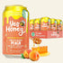 A 11 fl oz can of Yes Honey Bee Vitalized Peach juice in front of a 12-pack display box, with peaches and honey dripping on a white background.