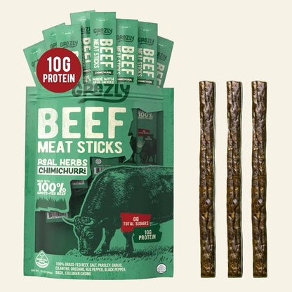 A package of Grazy Beef Meat Sticks shown with five individual stick packets fanned behind the main bag and four long brown meat sticks displayed to the right on a white background.