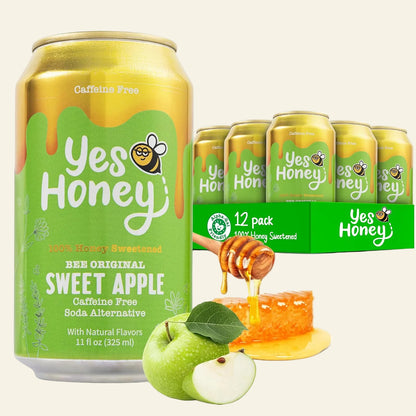 A 11 fl oz can of Yes Honey Sweet Apple beverage in the Bee Original flavor, shown alongside a 12-pack display box, green apples, honeycomb, and honey dripping from a wooden dipper on a white background.
