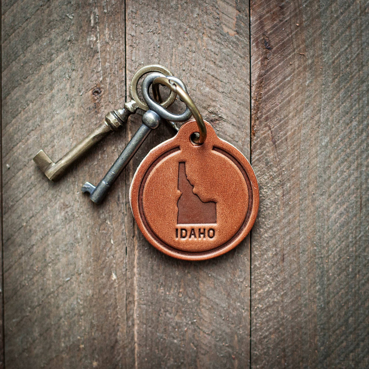 Idaho State Silhouette Leather Keychain Circle