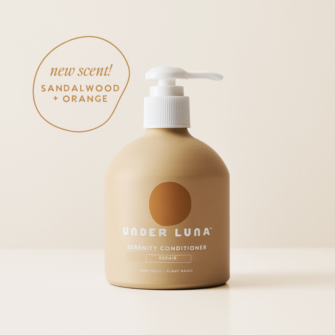 Beige conditioner bottle with pump labeled &