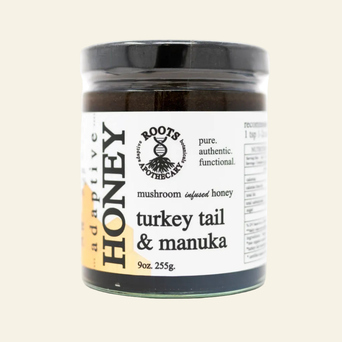 Jar of turkey tail and manuka honey with Roots Apothecary label on a white background
