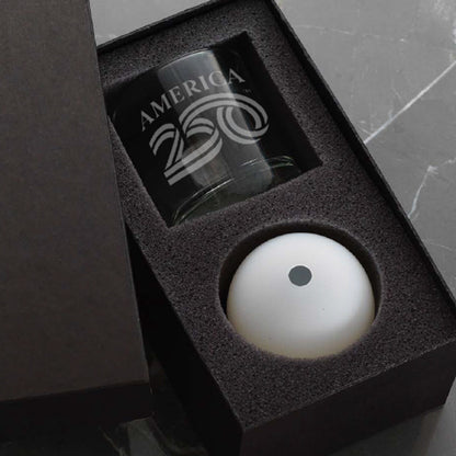 Gift set with a glass and a white ball in a black box