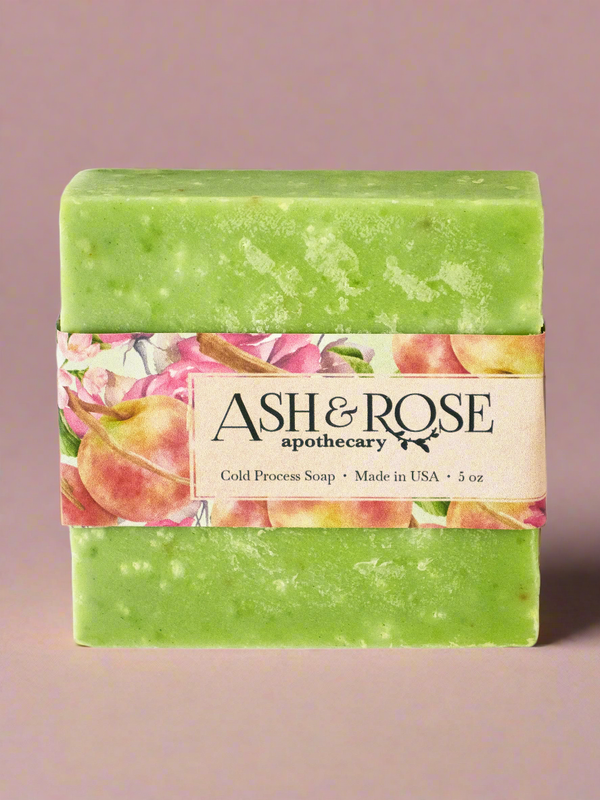 Green soap bar with a colorful label featuring the brand &