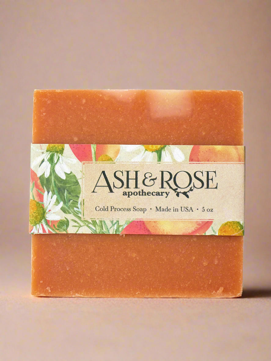 Bar of soap with a colorful label featuring the brand &