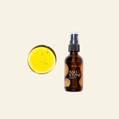 Brown bottle with spray nozzle labeled &