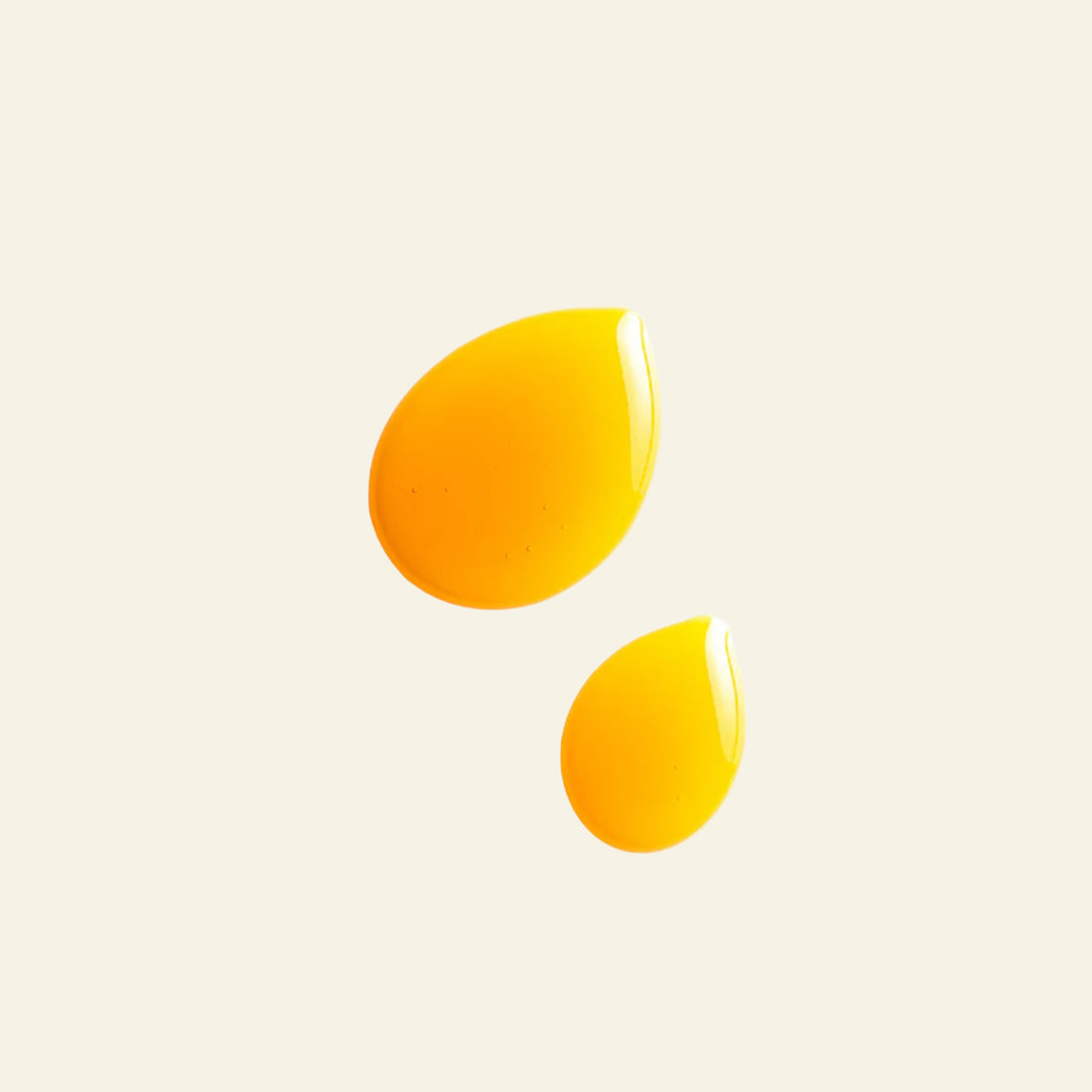 Two yellow droplet shapes on a white background