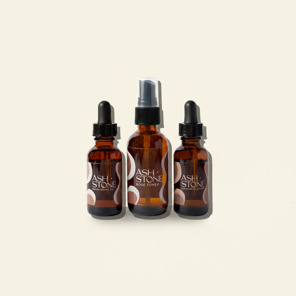 Three brown glass bottles with black caps labeled &