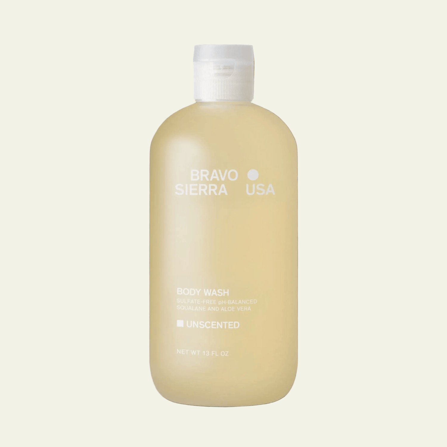 Beige body wash bottle with white cap on a gray background