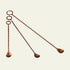 Set of four copper muddlers on a white background