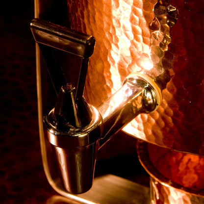 Close-up of a wine bottle stopper with a copper finish.