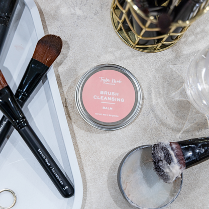 Makeup brushes with a container labeled &