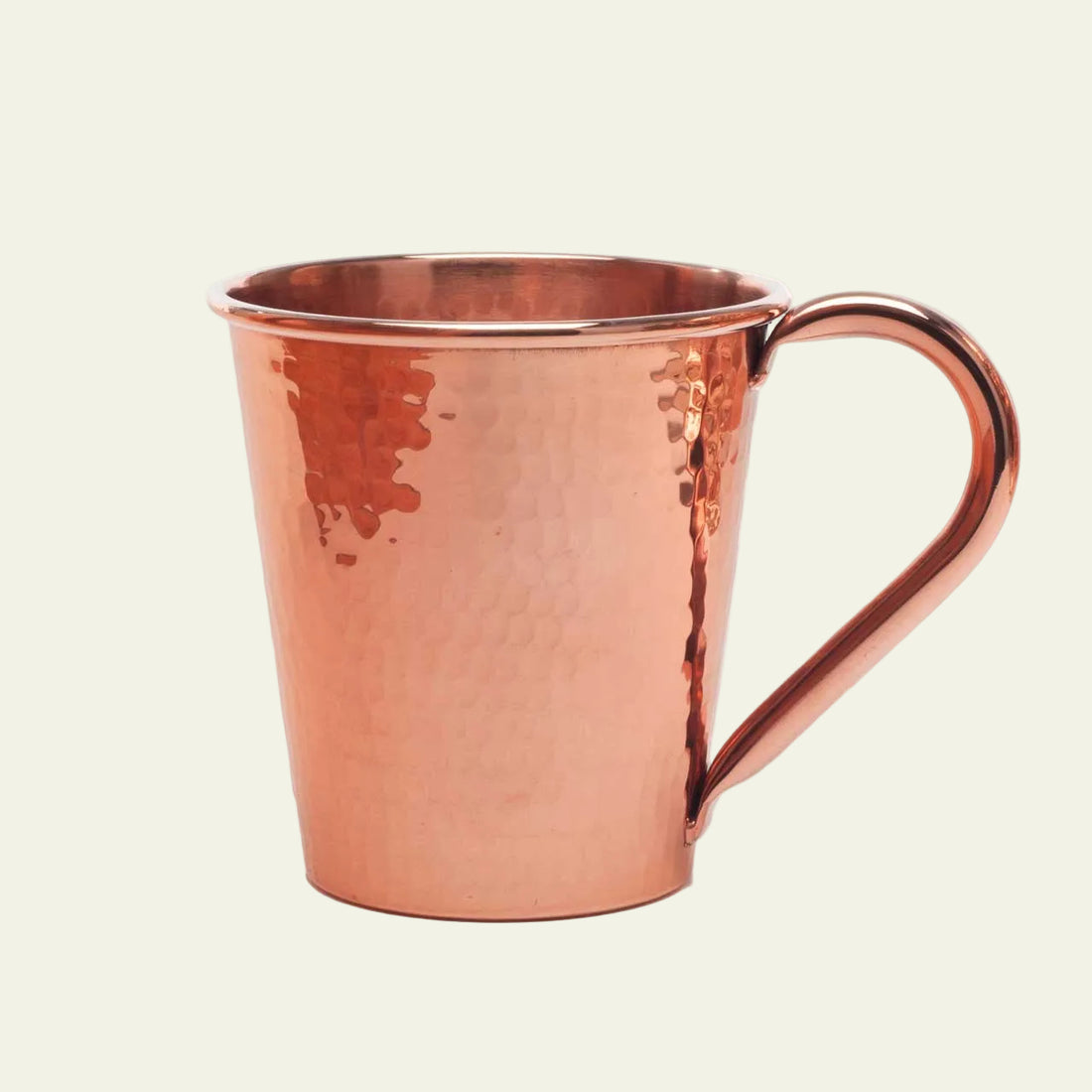 Copper mug with a handle on a white background