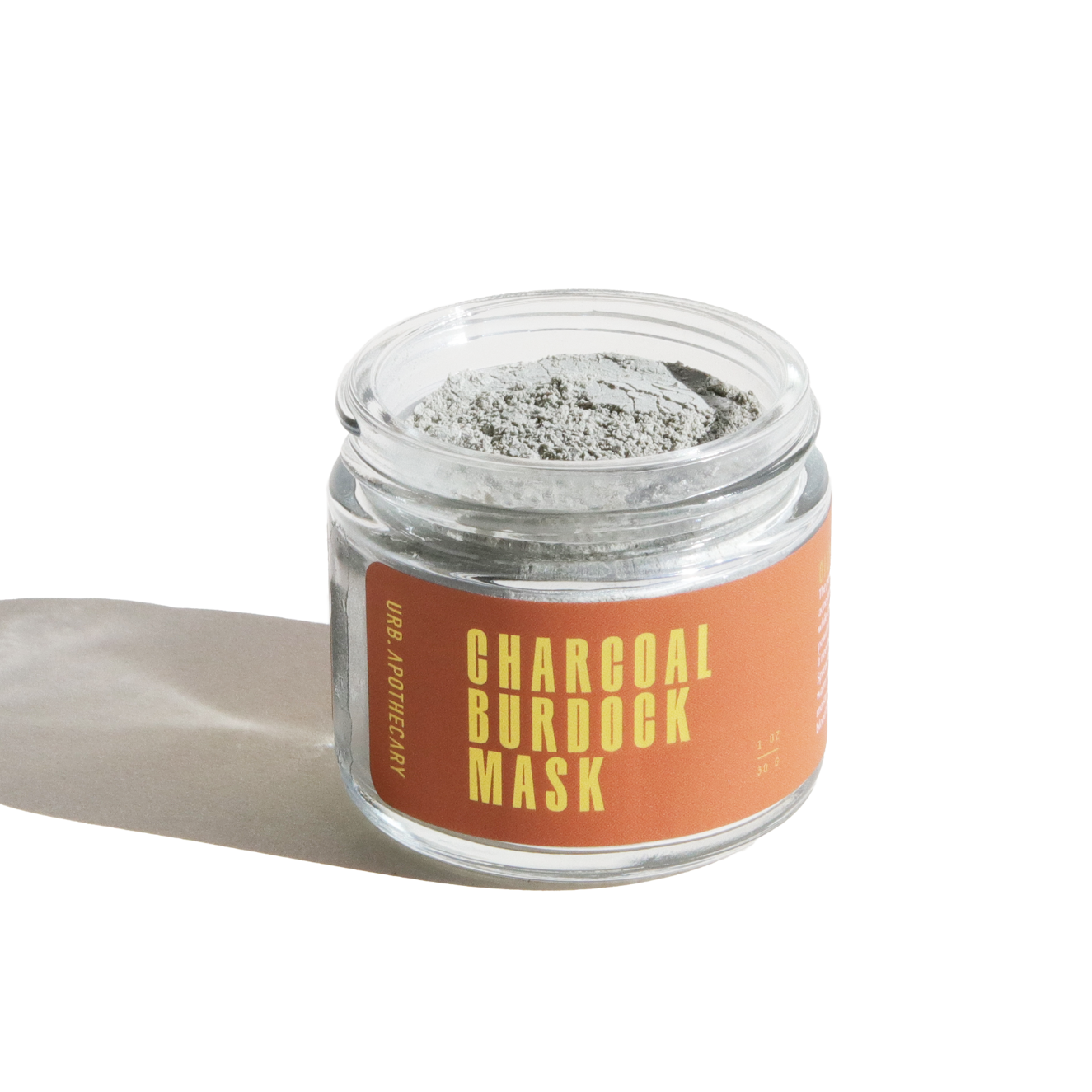 Jar of Charcoal Burdock Mask with a white background