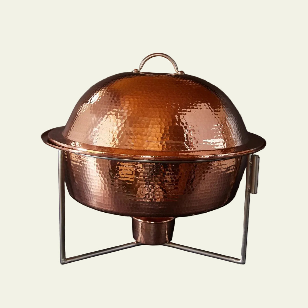 Copper chafing dish with a dark background
