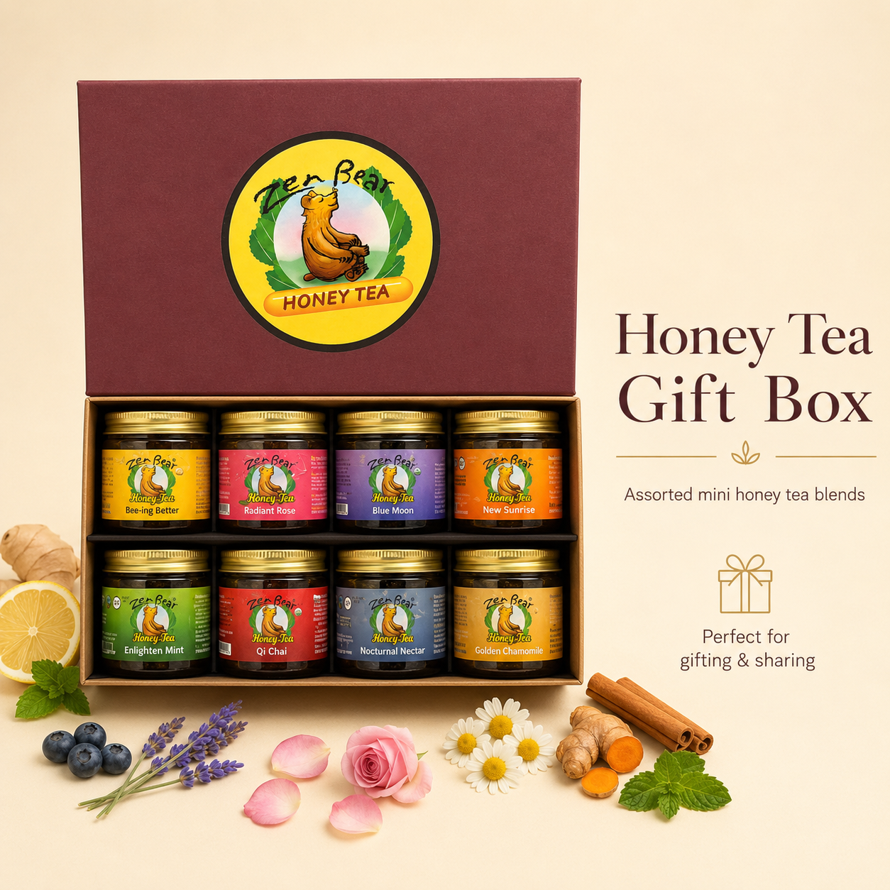 A Tees&amp;Bee Honey Tea gift box set displayed on a warm cream background. The open burgundy box contains eight mini jars of assorted honey tea blends with gold lids.