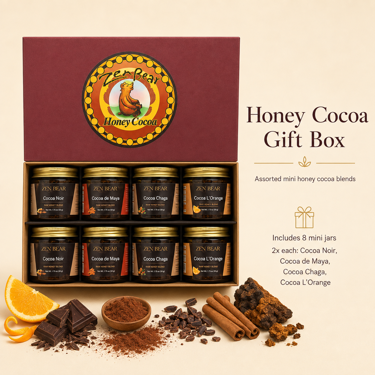 Zen Bear Honey Cocoa Gift Box containing 8 assorted mini jars of cocoa powder blends, displayed on a warm beige background with chocolate pieces, cinnamon sticks, and orange slices.